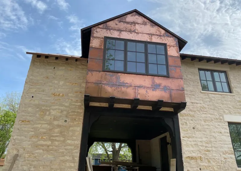 Copper metal panel facade on a stone building for Roof Repair in Monterey Park