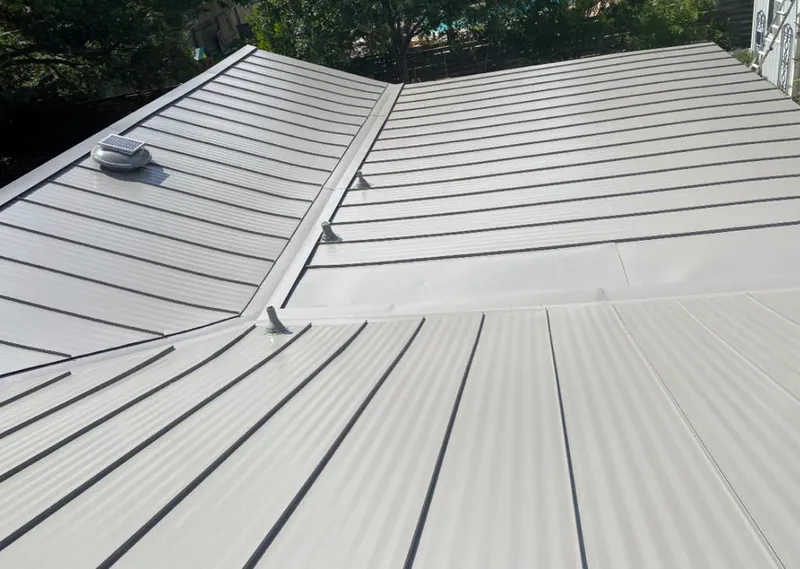 Solar attic fan installed on a metal roof for Roof Ventilation in Monterey Park