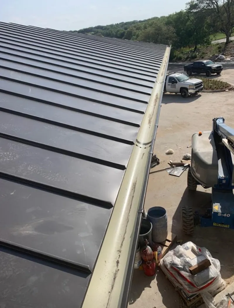 Standing seam panel and gutter detail on a metal roofing jobsite in Monterey Park